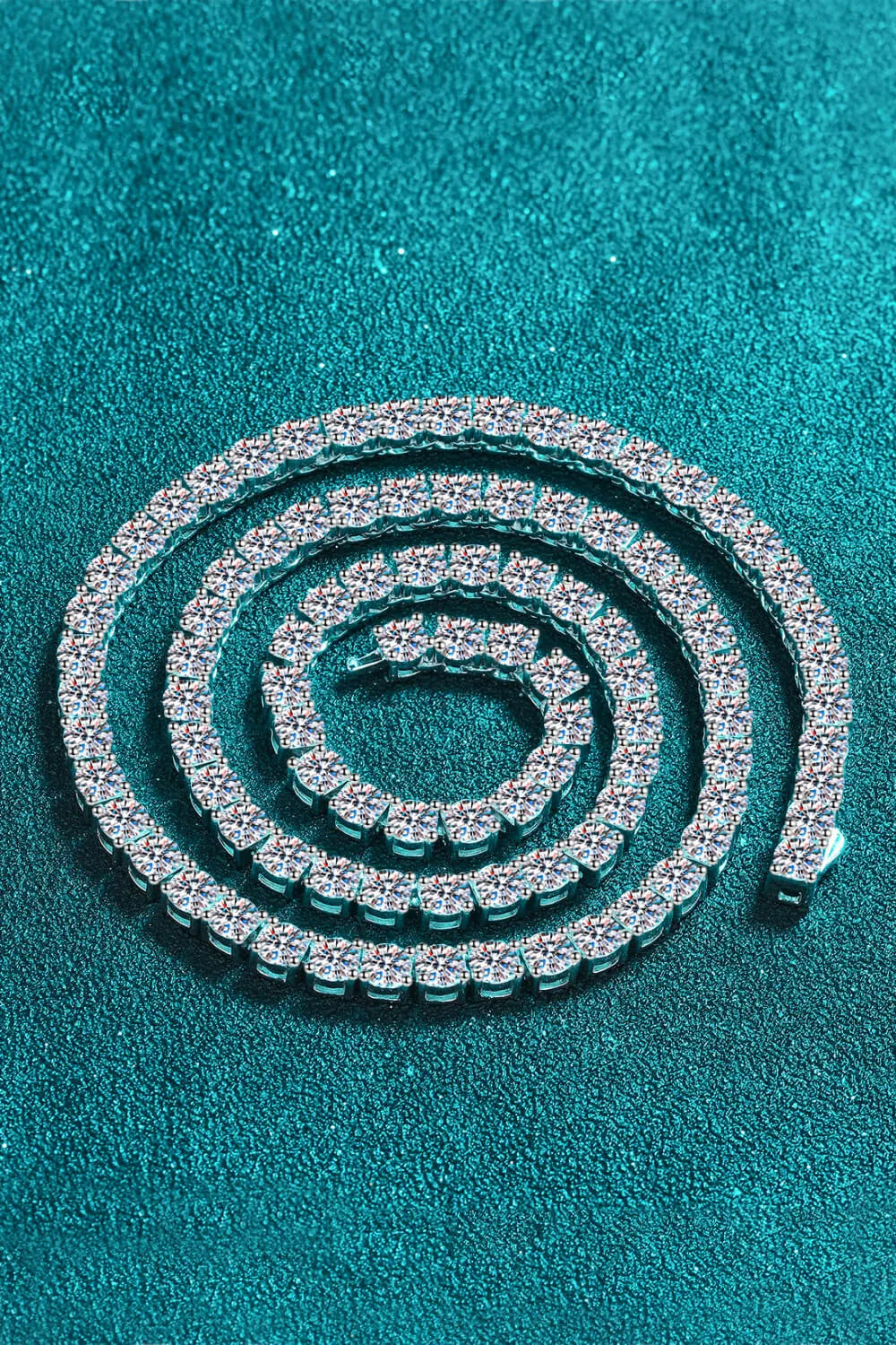 Silver chain on a teal background